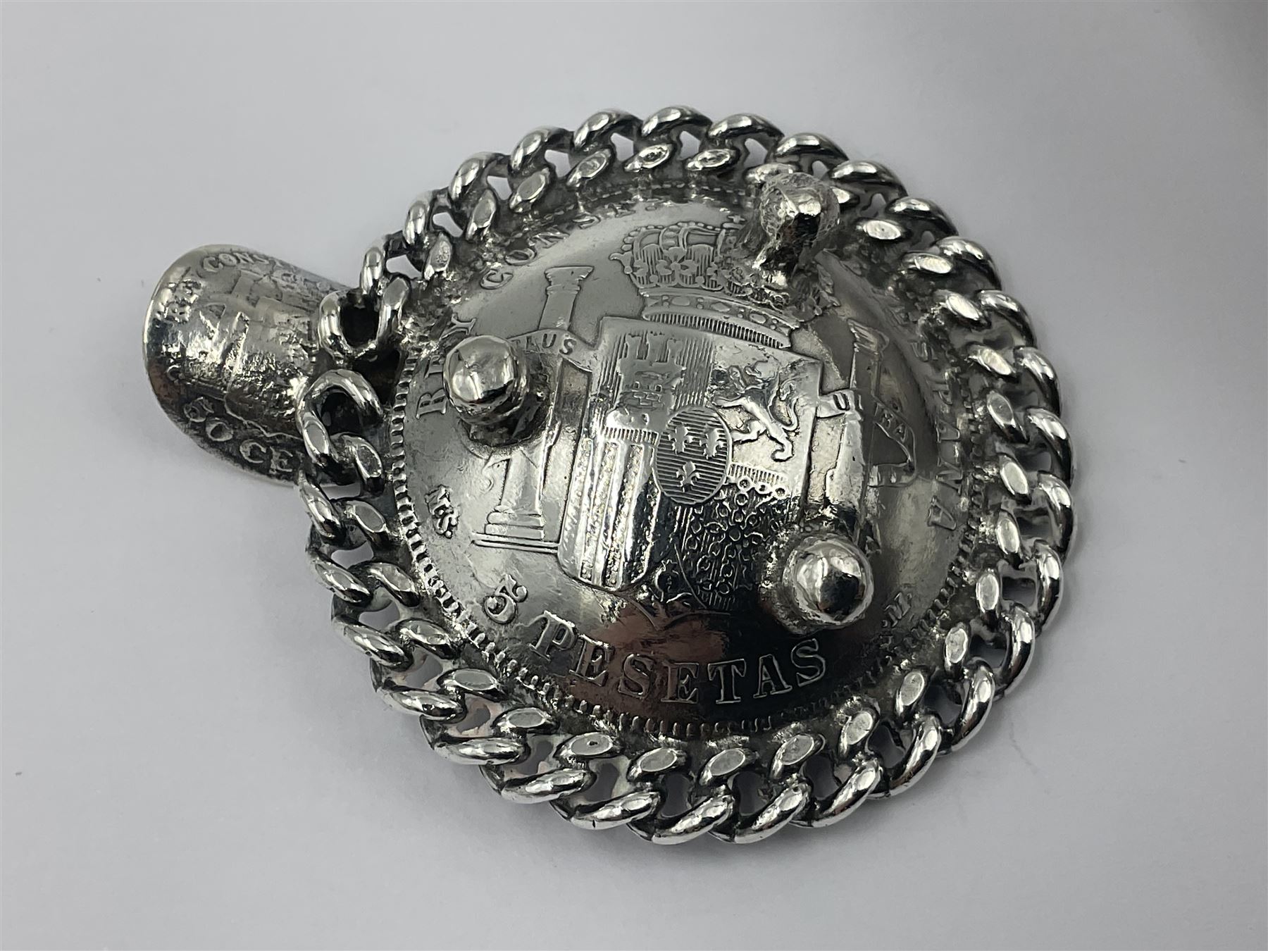 Spanish silver coin dish, with white metal chain rim and upon three ball feet, together with a silver plated armada style dish, with cast racehorse and jockey to centre, coin dish D4.8cm, armada dish D20.5cm