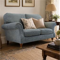 Marks & Spencer - 'Salisbury' two seater sofa, upholstered in blue fabric, scrolled arms a...