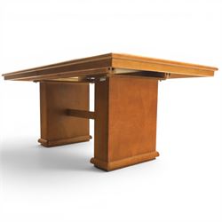 Modern Art Deco design walnut extending dining table, rectangular top with rounded moulded edge, geometric parquetry veneered panels, extending action with additional leaf extending to 220cm, on twin panelled pedestal supports with stepped plinth feet