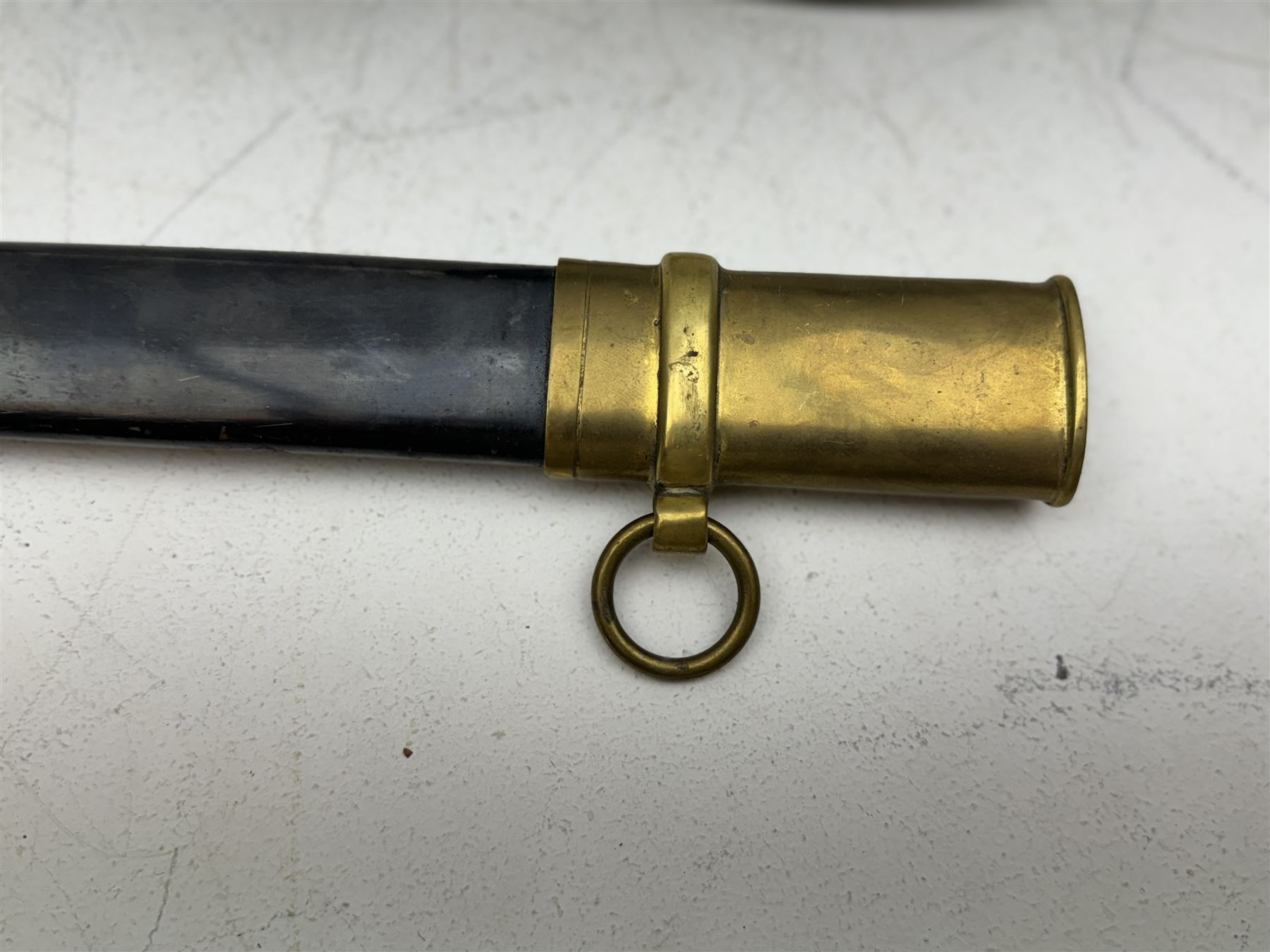 Replica Confederate States Army officer's sword, with brass pommel, black leather hand grip, the 85cm single edged blade marked CSA, in a metal and brass scabbard, L106cm