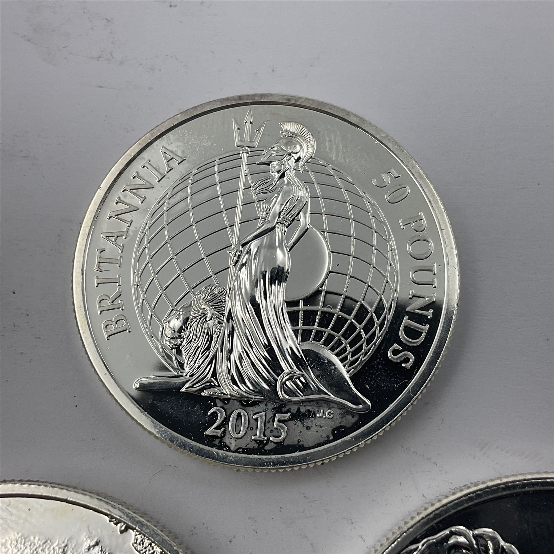 Five The Royal Mint United Kingdom fine silver coins comprising 2015 ‘Buckingham Palace’, 2016 ‘Big Ben’ and 2016 ‘Trafalgar Square’ one hundred pound coins, with 2015 ‘Britannia’ and 2016 ‘The Shakespeare Histories’ fifty pound coins