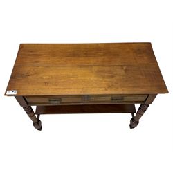 Victorian mahogany side table fitted with two drawers,  rectangular top over two short drawers with moulded facias and brass drop handles, turned front and rear supports joined by an open undertier, on turned feet 