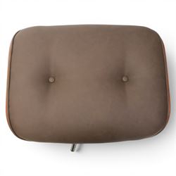 In the manner of Eames' Lounge chair, contemporary brown leather and plywood recliner and footstool, padded leather seat and arm rests, plywood backs raised on a black metal frames, reclines and swivels on a five point base  