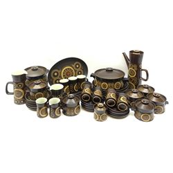 Denby Arabesque patter tea and dinner wares, comprising six dinner plates, twelve side plates, six twin handled bowls and covers, two tureen and covers, four oval serving platters, coffee pot, water jug, milk jug, cream jug, sucrier and cover, and eight coffee cans. 