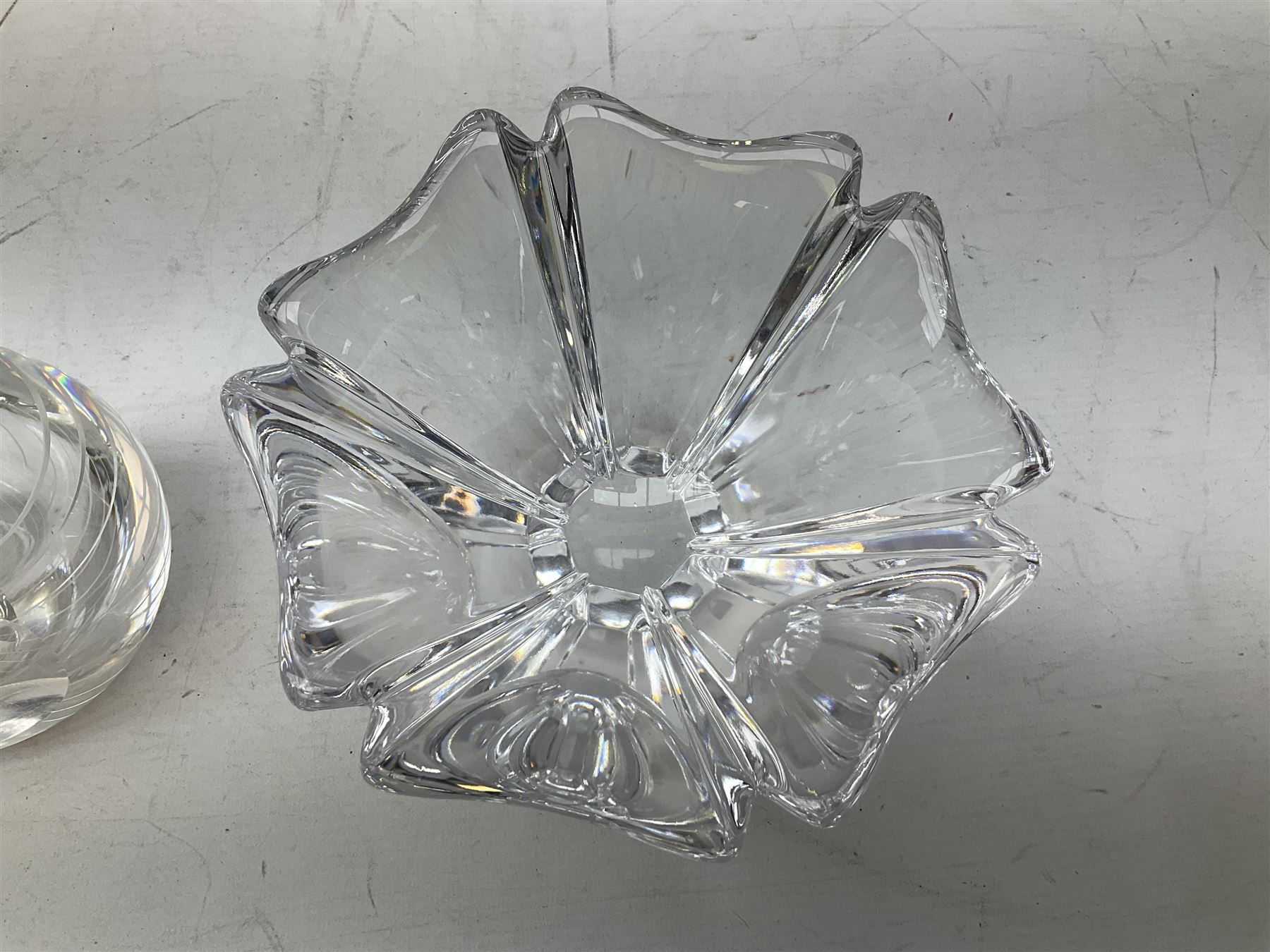 Two Orrefors Art Glass clear glass vases, the first example of compressed circular form, the second of tapering form with lobed rim, each signed beneath, tallest H14.5cm