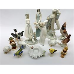 A group of figures, to include three Lladro examples, three Nao and a Nao model of a flower, five Goebel birds, two Goebel figures, etc. 