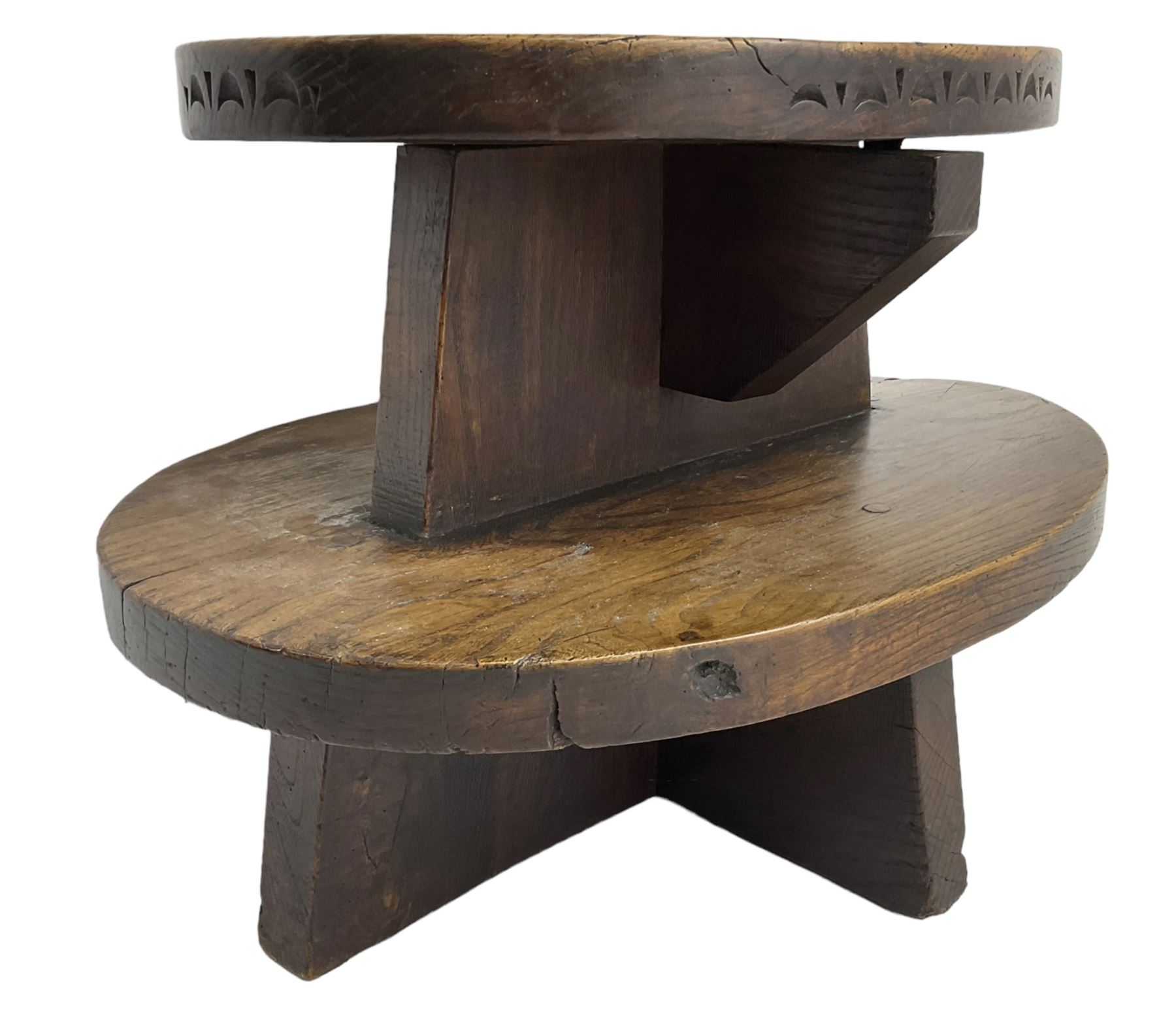 20th century figured elm occasional table, two oval tiers raised on cruciform base, the top tier carved with incised decoration 