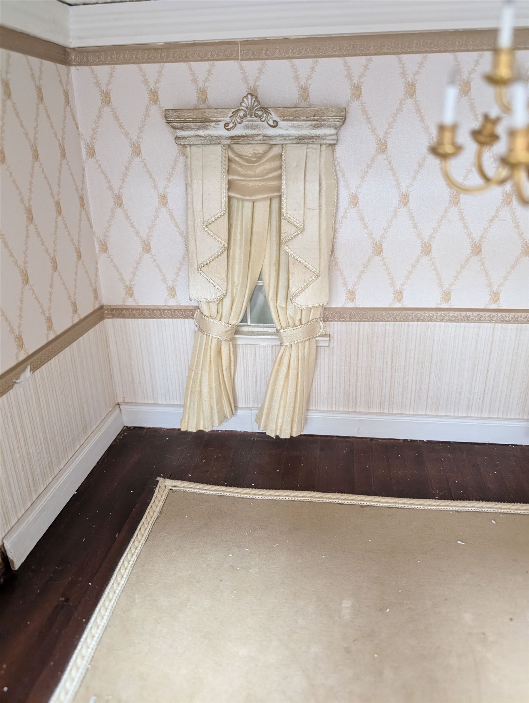 Two modern three storey dolls houses, each painted green with decorated interiors, both upon a single white wooden base, together with a large collection of dolls house furniture, accessories and figures 