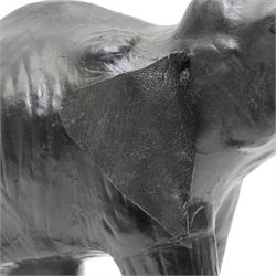 In the style of Liberty & Co - pair of 20th century ebonised papier mache elephants 