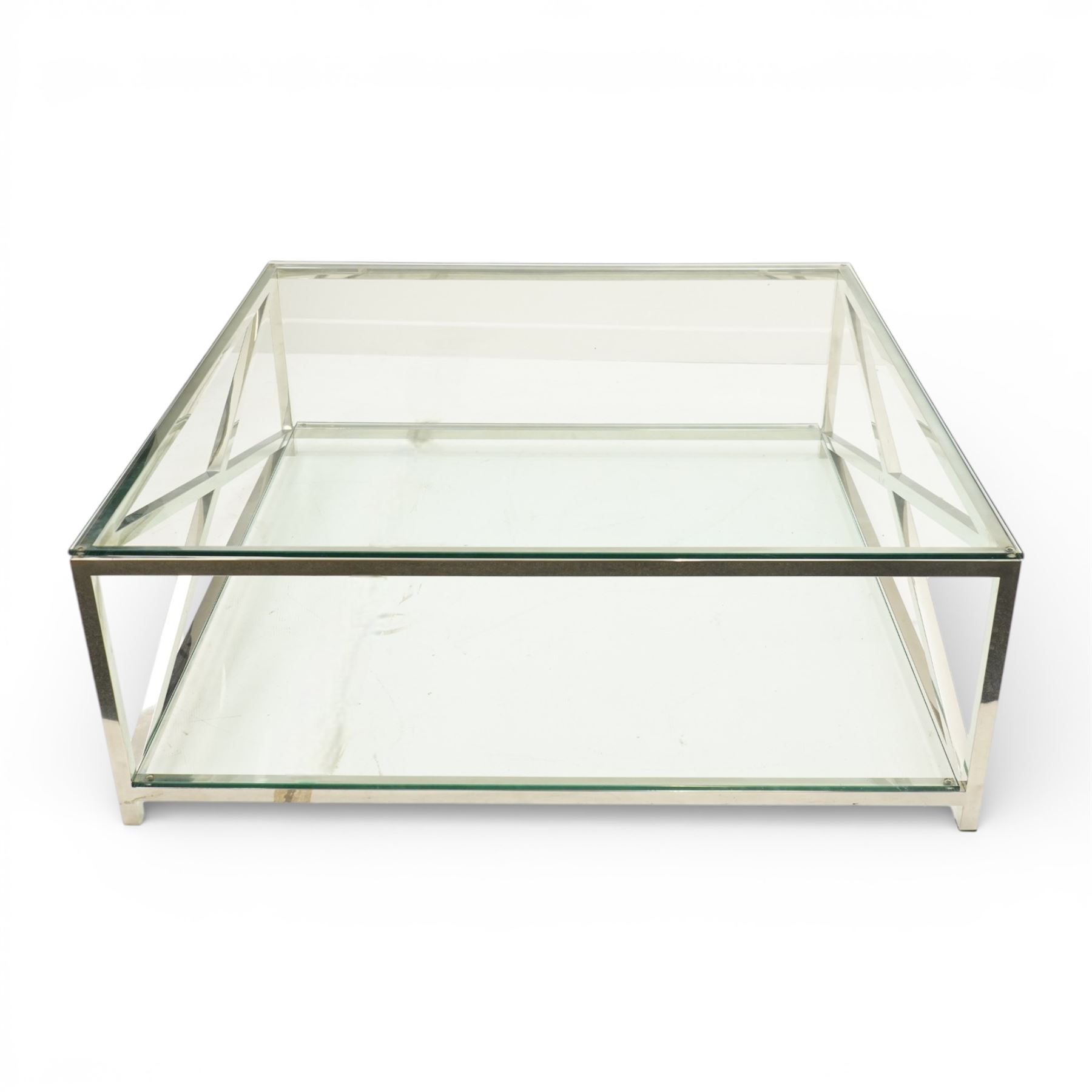 Modern chrome and glass coffee table, square plate glass top on polished chrome frame, the sides formed with X-frame stretchers, raised on square supports with lower glass tier