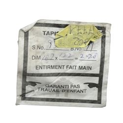 Persian design ivory ground rug, overall floral design with shaped central medallion, the main border decorated with trailing flower head pattern, within guard stipes 