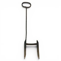 19th century wrought iron boot scraper, with oval loop handle upon twin blades united by c...