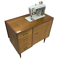 Mid-20th century teak sewing machine workstation, with Singer 611G sewing machine, fitted with four drawers and cupboard 
