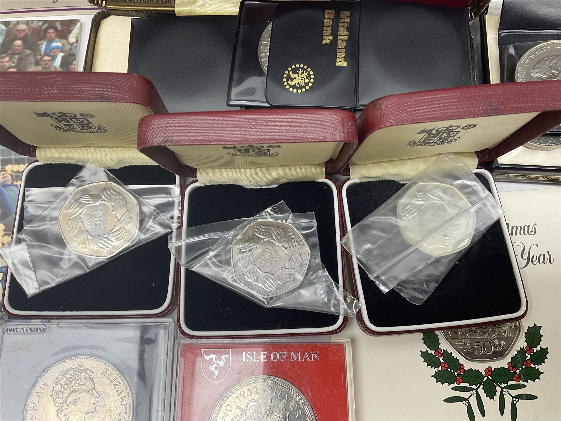 The Royal Mint United Kingdom 1983 proof coin collection in blue folder with certificate, 1983 uncirculated coin collection, two 1987 brilliant uncirculated coin collections, commemorative crowns etc