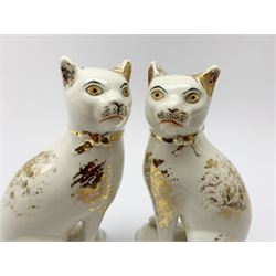 Pair of Victorian Staffordshire cats, modelled seated upon cushions, with gilt detail throughout, H18cm