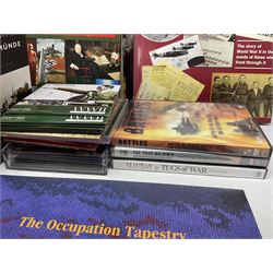 Thirty modern books of military interest including The Wartime Scrapbook 1939-1945; D-Day by Stephen Badsey; The D-Day Experience by Richard Holmes; Desert Rats by John Parker; A Most Secret Squadron by Des Curtis; Flying Colours - The Epic Story of Douglas Bader by Laddie Lucas etc; and quantity of DVDs of war and military interest