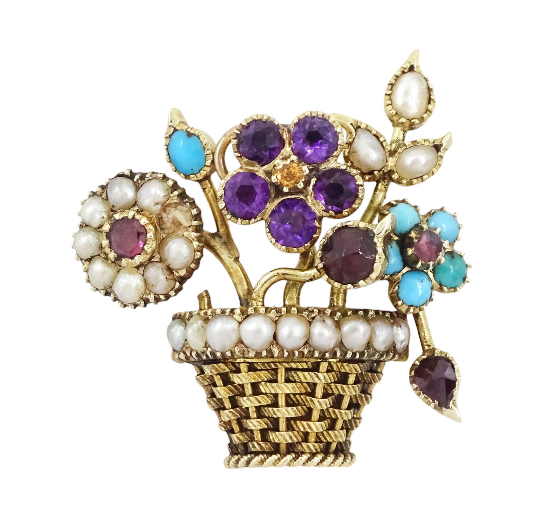 19th / 20th century gold multi gemstone set flower basket brooch, the flowers set with garnets, amethysts, seed pearls and turquoise, in a seed pearl woven basket, with a glazed back