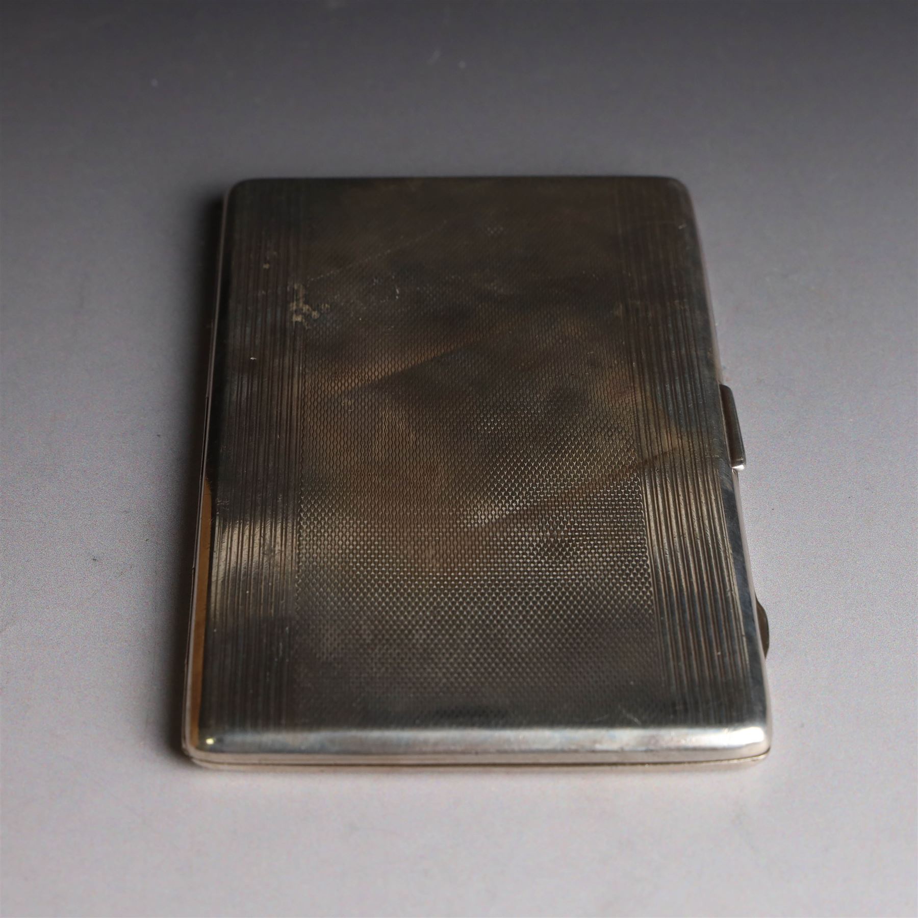 1920s silver cigarette case, with engine turned decoration and vacant cartouche, hallmarked Harman Brothers, Birmingham 1921, H13cm