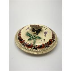 18th century creamware teapot, probably Leeds, with reeded entwined handle and floral finial to the cover, the body with hand painted polychrome decoration of figure to one side, and floral spray to the other, collectors paper label beneath inscribed Leeds Pottery, H11.5cm