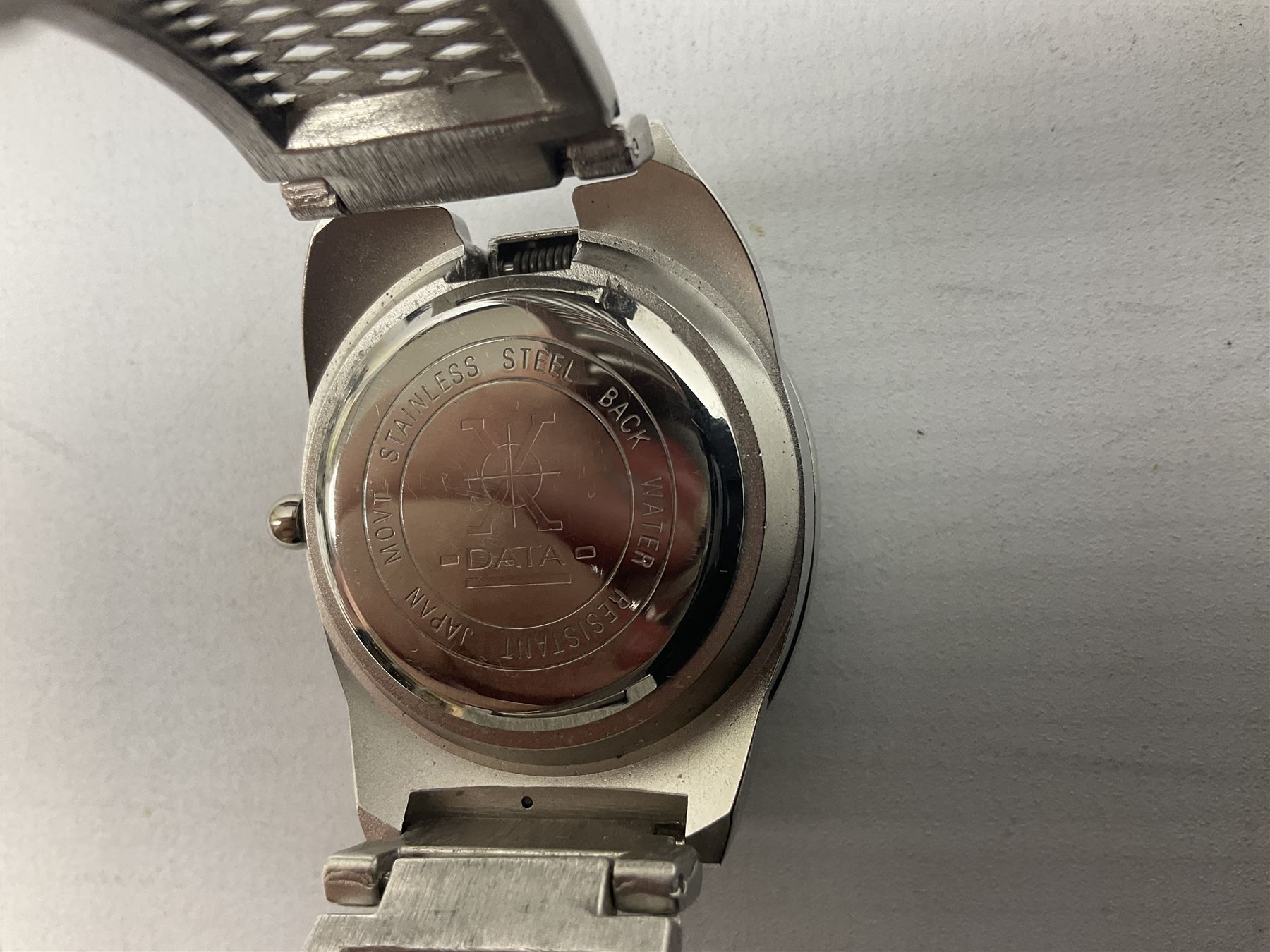 Four X Data stainless steel wristwatches, two Marc Gay wristwatches and one other, all with cover plates