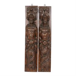 Pair of 17th century carved oak terms, each depicting a male figure in headpiece, with fish tail beneath fruits, 51.5cm