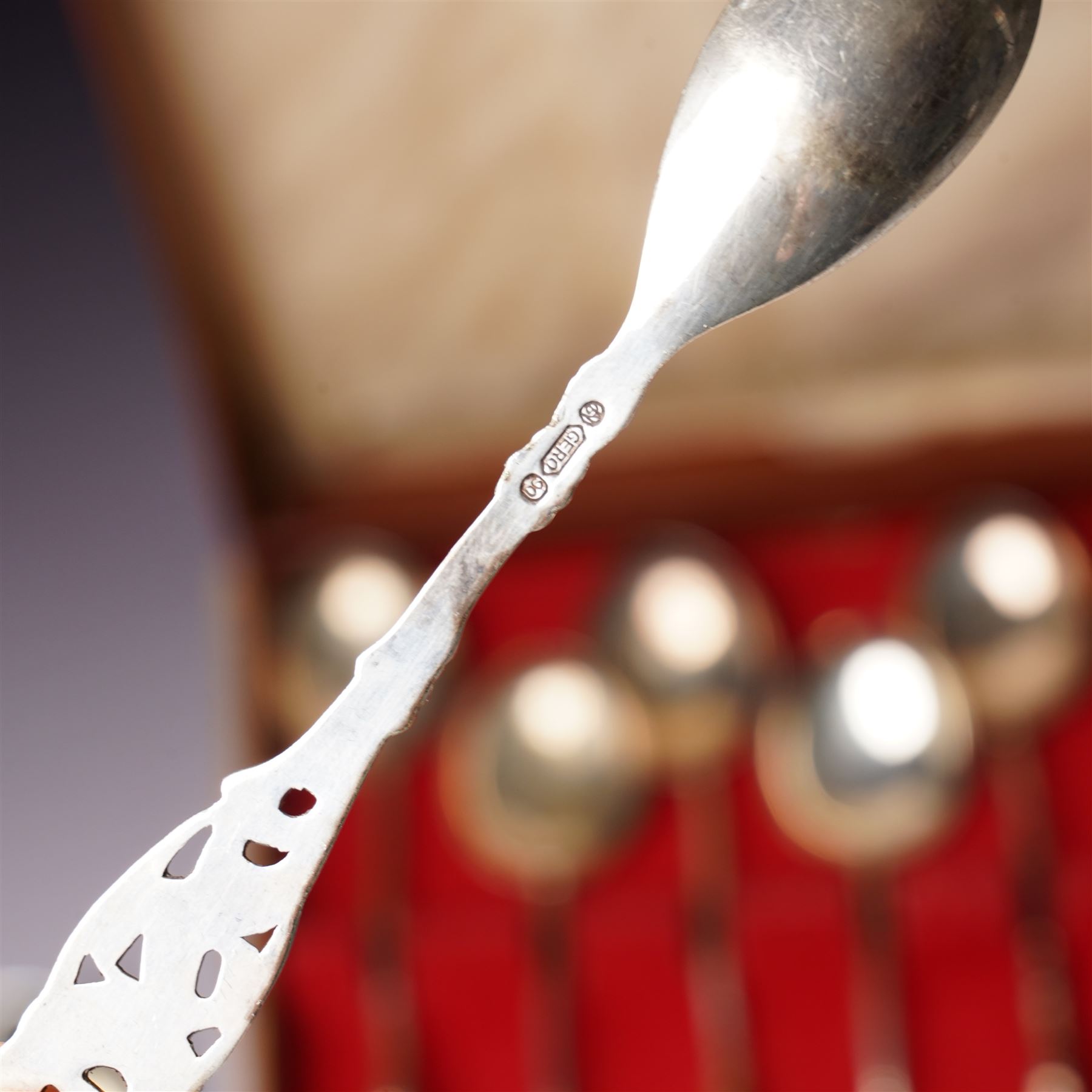 Five Russian 84 standard silver teaspoons with niello work stems and bowls marked 1876, five silver coffee spoons with swans head handles Birmingham 1910, Dutch Gero 90 standard preserve spoon and an early 19th century silver mustard spoon