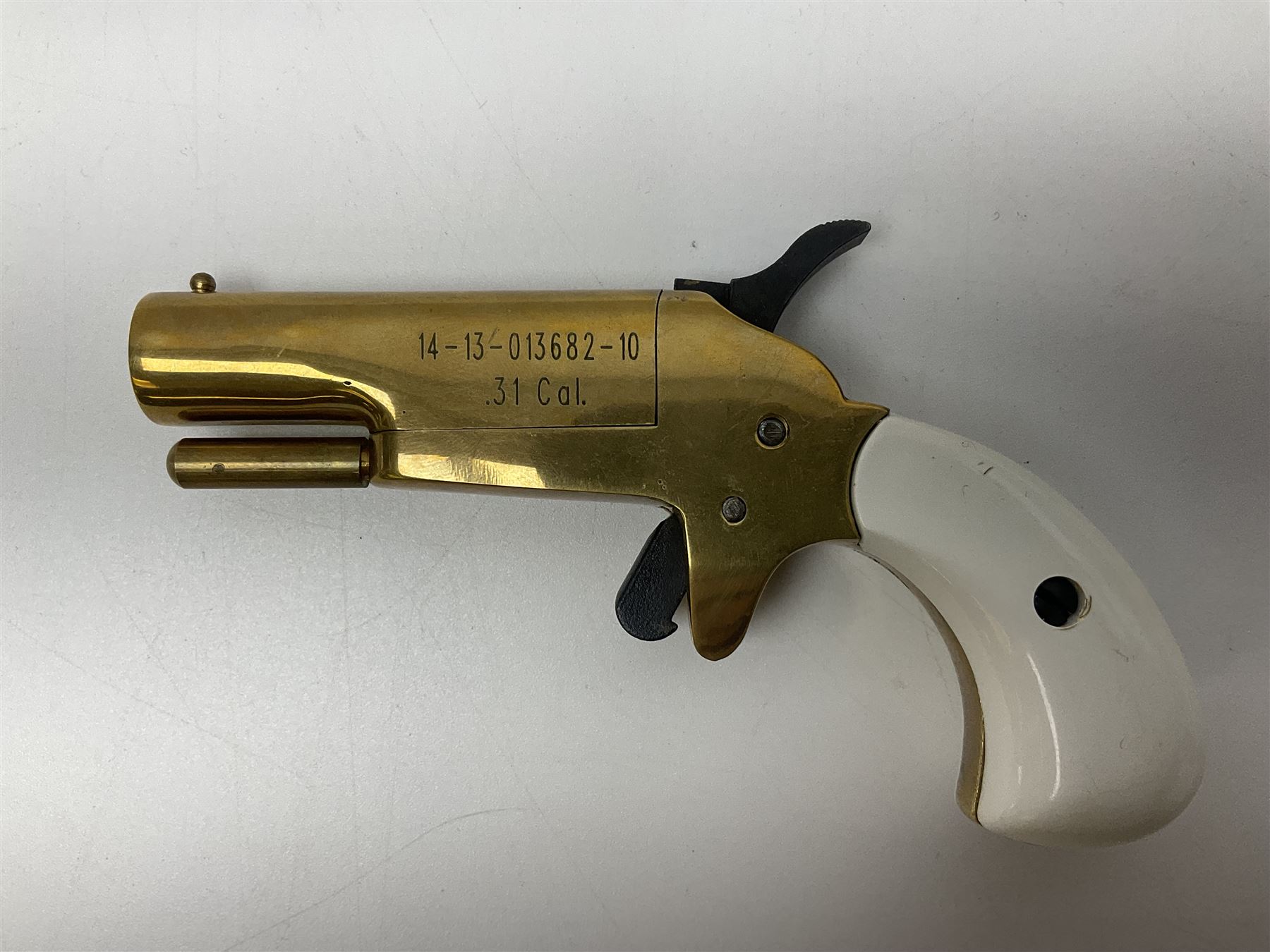SECTION 1 FIRE-ARMS CERTIFICATE REQUIRED - Spanish Ardesa percussion vest pocket Derringer pistol, .31 cal. black powder; single shot; 6cm barrel; all brass body with white grips; no.14-13-013682-10 with Spanish certificate dated 2010 and box of one hundred balls