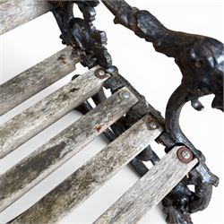 Victorian revival Coalbrookdale 'Dog and Serpent' pattern heavy cast iron garden bench, grape vine detail, joined with eight hardwood slats, finished in black paint