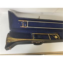 Three brass trombones comprising Elkhart Ind. USA 'CONN' model no.72H; Besson 'Concord'; and Selmer Distributed 'Lincoln'; two in carrying cases; and German B & M 'Champion' brass trumpet (4)