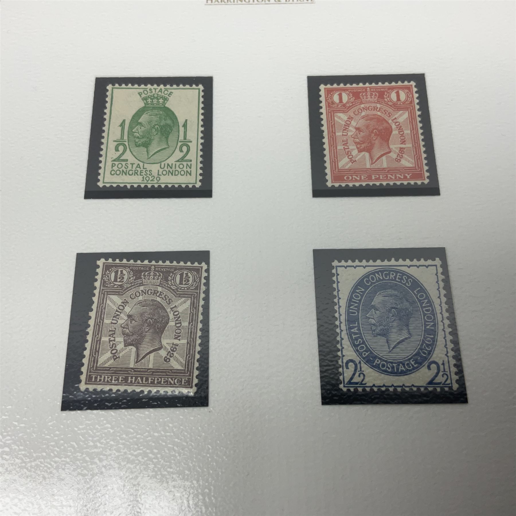 Great Britain King George V 1929 Postal Union Congress one pound stamp, halfpenny green, penny scarlet, one and a half pence purple-brown and two and a half pence blue, all unused, housed in a Harrington and Byrne folder