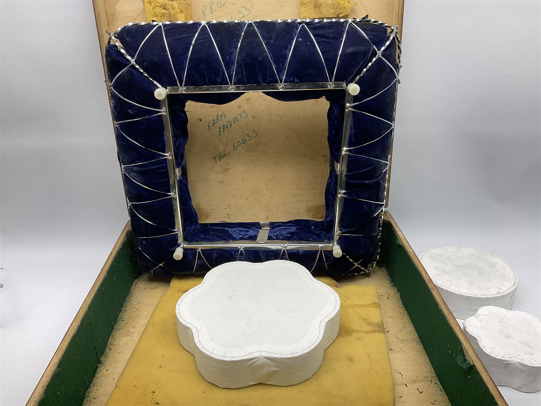 Edwardian wedding cake stand, the blue velvet cushion applied with wirework scroll, in wood box, 56cm X 56CM