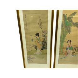 Japanese School (20th century): Young Women in the Garden, pair watercolours on silk signed with artists seal and signature 59cm x 23cm (2)