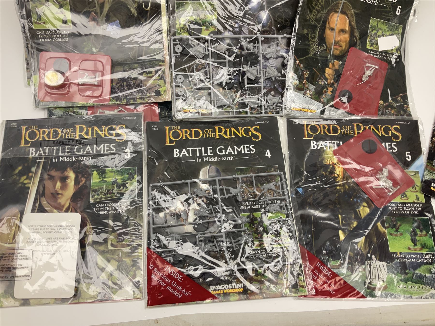 DeAgostini Lord of the Rings Battle Games in Middle-Earth magazines, issues 1 - 28 (lacking no.2), with models, all but one unopened, unbuilt and unpainted (27)