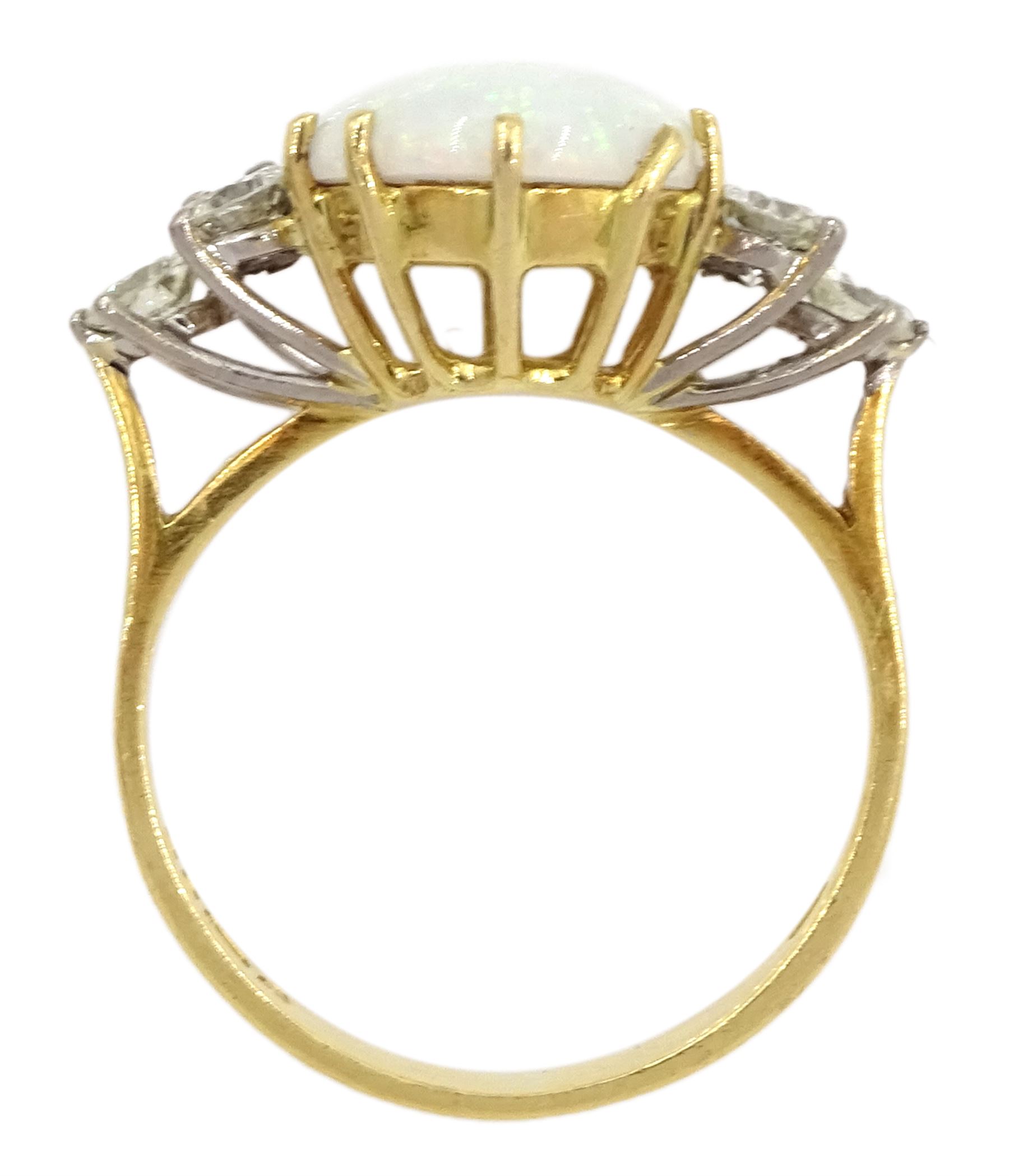 18ct gold opal and six stone round brilliant cut diamond ring, London 1977, opal approx 2.60 carat, total diamond weight approx 0.65 carat