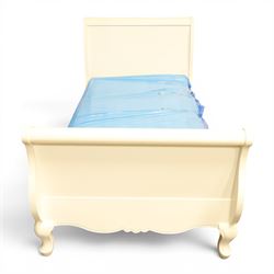Modern white painted single sleigh bed frame and mattress, with scrolled head and footboard with foliage detail