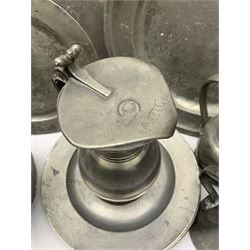 Collection of 18th and 19th century pewter, comprising two chargers, eight large plates, twenty six smaller plates, two bowls, three lidded measures, two jugs, tappit hen, and tankard, the plates with various marks and touch marks, including pseudo 'hallmarks', largest charger 37cm, large plates D30cm, smaller plates D24.5cm, tappit hen H26.5cm