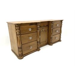 Victorian pine dresser base,  fitted with six drawers and central cupboard, applied half turned pilasters