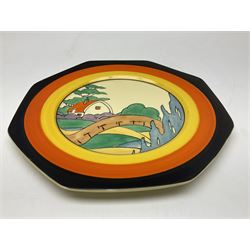 Clarice Cliff Bizarre for Newport Pottery Orange Roof Cottage pattern plate, circa 1932, hand painted with a stylised cottage and bridge landscape with yellow, orange and black banding, black printed mark beneath, D22cm 