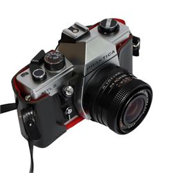 Three 35mm film SLR cameras, comprising Canon EOS 50E camera body with a Canon Ultrasonic EF 28-80mm 1:3.5-5.6 lens, together with a Canon EOS 600 camera body with a Sigma UC 28-70mm 1:3.5-4.5 lens and a Praktica MTL5 with a Carl Zeiss Jena DDR MC Flektogon 2.4/35 lens