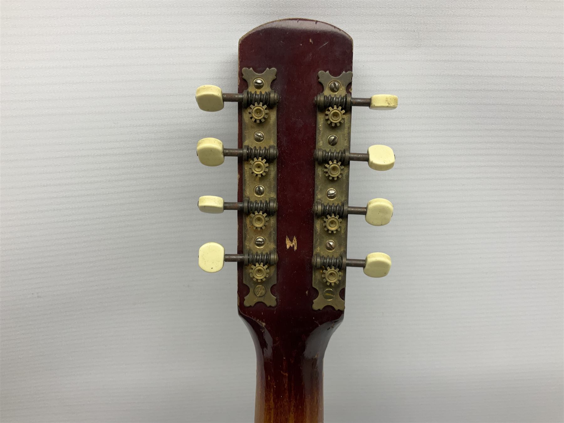 Dulcet eight-string banjo mandolin with mother-of-pearl inlaid ebonised fingerboard L55.5cm; cased; and Irish mahogany bodhran hand drum with inlaid stringing and vellum top D46.5cm; in soft carrying case with double ended beater (2)