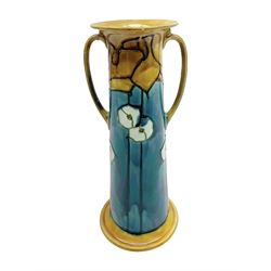 Minton secessionist vase, of tapering form with twin handles, decorated with white flowers on a blue and yellow ground, H29cm