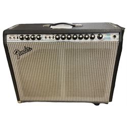 1970s Fender Twin Reverb professional amplifier No.A66744, made in USA, with swivelling side angle stands and cover L66cm H58cm; with original purchase invoice for £350 from Gough & Davy Hull dated 1976.