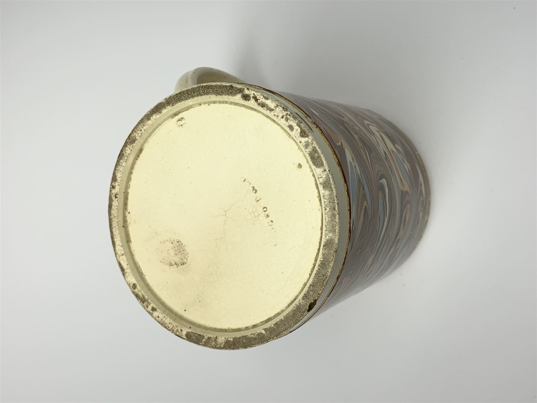 Late 18th century earthenware mug, possibly Ralph Wedgwood, Burslem or Ferrybridge, with surface marbled decoration and later gilt detail to rims and handle, impressed beneath Wedgwood & Co, H12cm