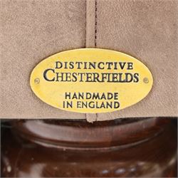 Distinctive Chesterfield - Chesterfield upholstered in taupe leather, deep button back and arms, loose seat cushions, raised on dark stained supports 