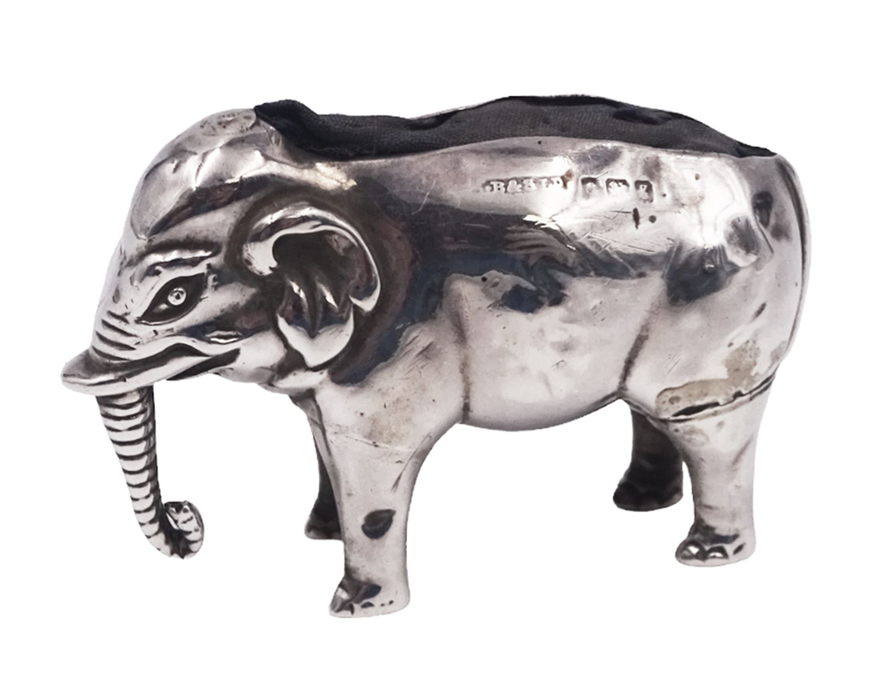 Edwardian silver novelty pin cushion, modelled as an elephant with cushioned back, hallmarked Birmingham 1906, maker's mark indistinct, H3.2cm, approximate total weight 0.46 ozt (14.1 grams)