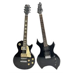 Stagg heavy metal style six-string electric guitar, finished in black with chrome tuning pegs, fret markers and humbucker pickups to bridge L106cm; and Hondo USA electric guitar with black body, ivory coloured pickguard and mother-of-pearl fretmarkers L101cm (2)   