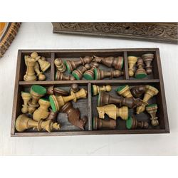 Two Scott-Ford framed silhouettes, featuring the standing profile study of a man dated 1929 and a pair of women dated 1929 and 1930, together with a box containing wooden chess pieces and a serving tray 