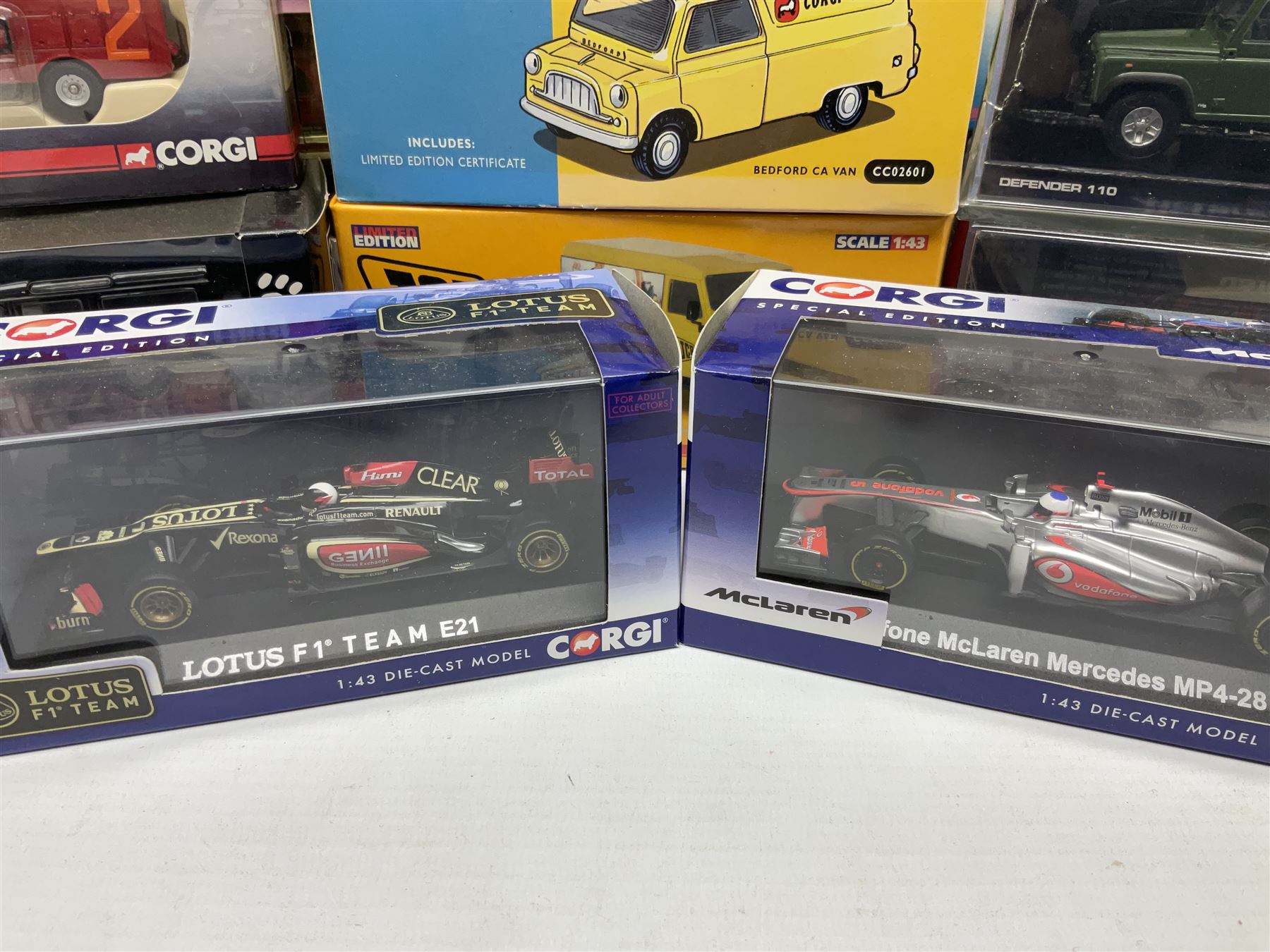 Corgi - eighteen modern die-cast models including racing cars, Land Rovers, Thornycroft Box Van, Ford Transit and Bedford Vans, Minis, Last Routemaster bus, two Trackside DIYCAST sets etc; all boxed (18)