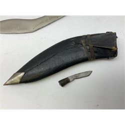 Small kukri with 11.5cm curving steel blade and horn grip; in leather scabbard L20cm overall; another larger Indian kukri in leather scabbard with one skinning knife L33cm overall; unmarked wakisashi blade; machete with silver painted blade; police patrol truncheon; and WPC short truncheon (6)