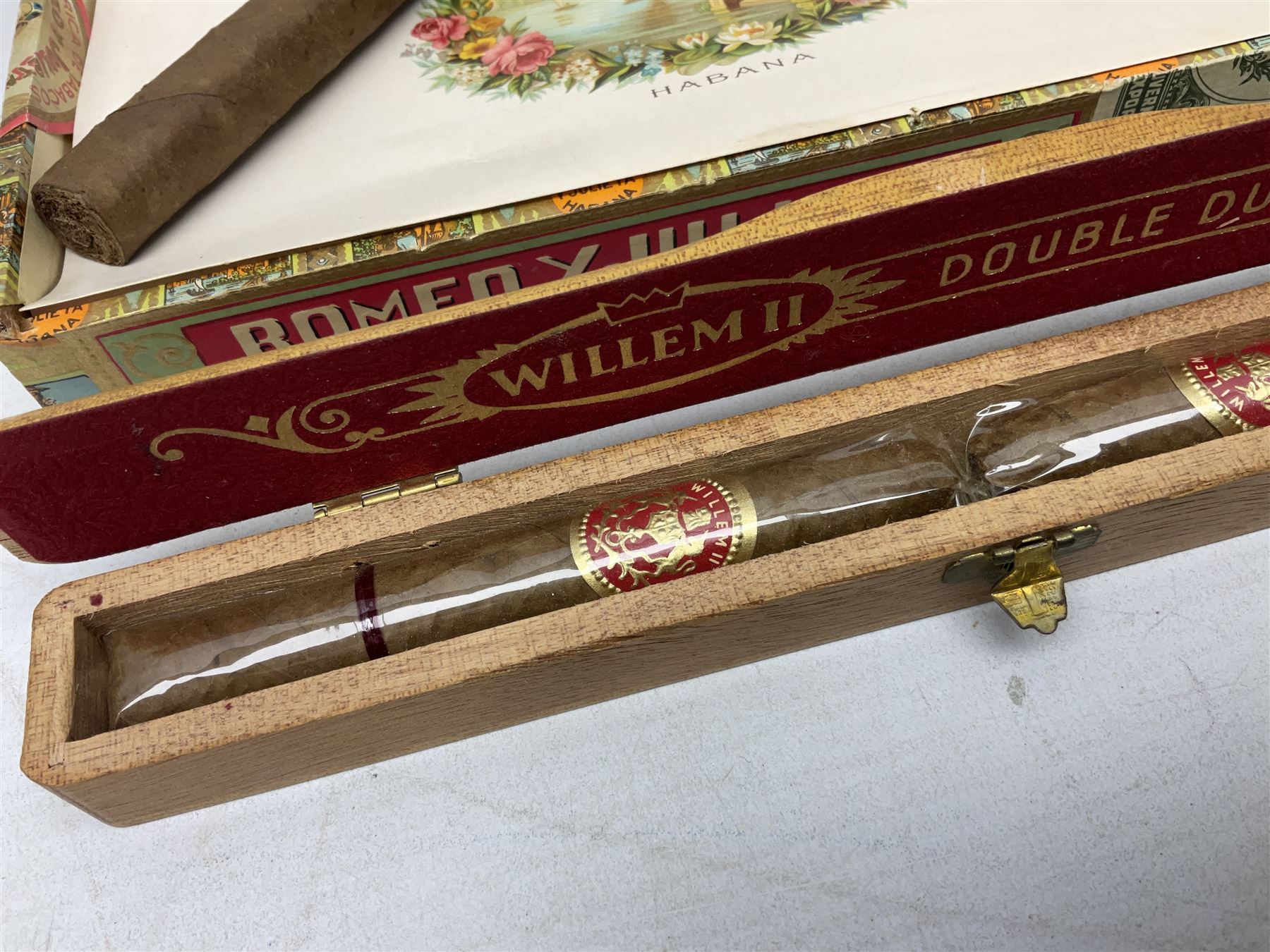 Victorian leather cigar protector with metal match striking plate on the end, and quantity of boxed cigars, comprising Willem II Churchill cigar, Willem II double dutch, Quintero Y Hno Habana cigars and Romeo Y Julieta, habana